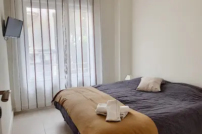 Un ou plusieurs lits dans un hébergement de l'établissement Sublime Apartment Center Croisette LIVE IN Moliere
