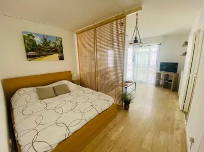 Un ou plusieurs lits dans un hébergement de l'établissement Confort - Appartement Cosy - Proche Mer ***