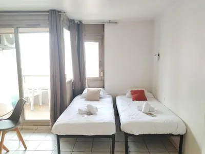 Un ou plusieurs lits dans un hébergement de l'établissement Résidence Graziella Studio 408