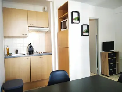 Cuisine ou kitchenette dans l'établissement Résidence Graziella Studio 409