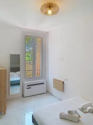 Un ou plusieurs lits dans un hébergement de l'établissement Residence le Courbet
