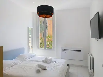 Un ou plusieurs lits dans un hébergement de l'établissement Residence le Courbet