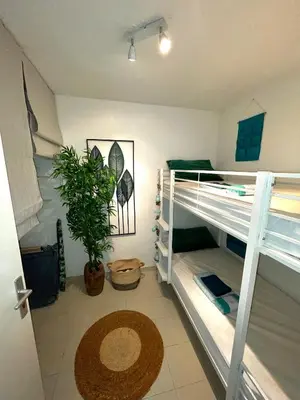 Un ou plusieurs lits dans un hébergement de l'établissement Appartement tout confort vue mer