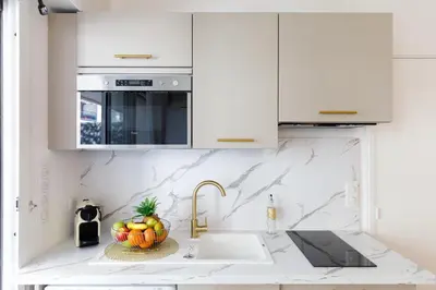 Cuisine ou kitchenette dans l'établissement Perle Dorée YourHostHelper
