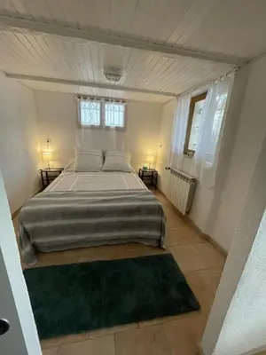 Un ou plusieurs lits dans un hébergement de l'établissement Villa Acacia