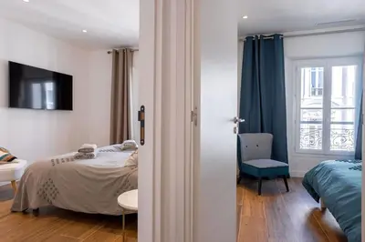 Un ou plusieurs lits dans un hébergement de l'établissement Luxury Apt With Balcony On Famous Rue D'antibes! - Kiss Apartment by Halldis