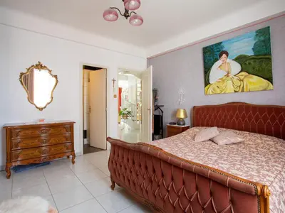Un ou plusieurs lits dans un hébergement de l'établissement Apartment le flora by Interhome