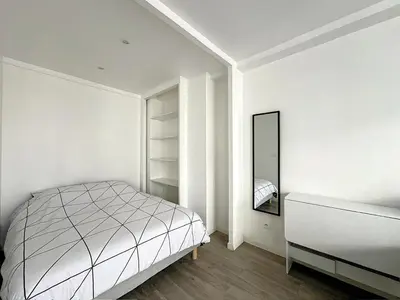 Un ou plusieurs lits dans un hébergement de l'établissement Superbe appartement avec terrasse centre-ville et plage à 5 min