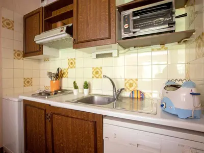 Cuisine ou kitchenette dans l'établissement Studio Montfleuri by Interhome