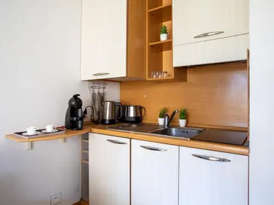 Cuisine ou kitchenette dans l'établissement Studio Le Royal Park by Interhome