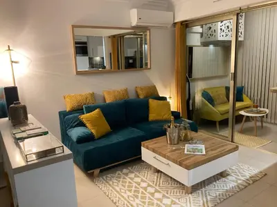 Coin salon dans l'établissement Appartement de standing Le Velvet Bay climatisé en bord de mer