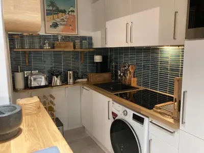 Cuisine ou kitchenette dans l'établissement Appartement de standing Le Velvet Bay climatisé en bord de mer